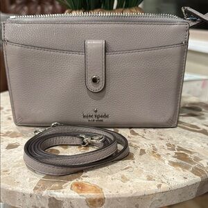 Kate Spade gray Leather JacksonCrossbody Bag. Straps measure approximately 21”